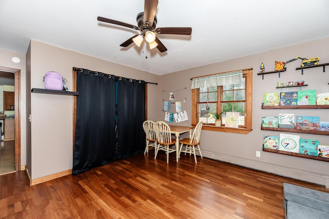 129 Bailey Hill Rd, New Sharon, ME 04955 - dining area with wood finished floors, a ceiling fan, and baseboards
