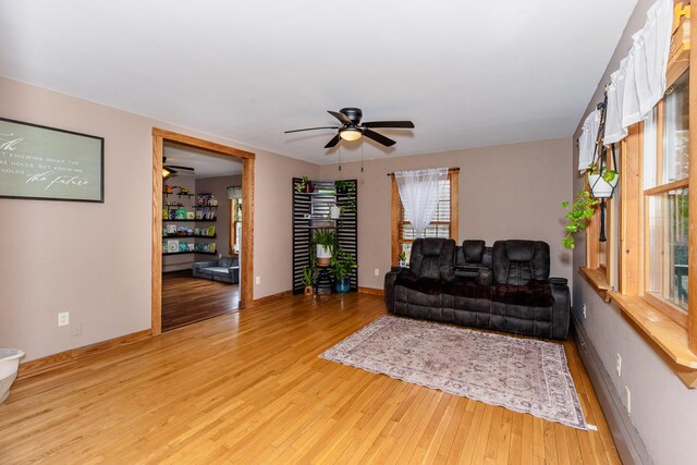 129 Bailey Hill Rd, New Sharon, ME 04955 - living area featuring wood finished floors, baseboards, and ceiling fan
