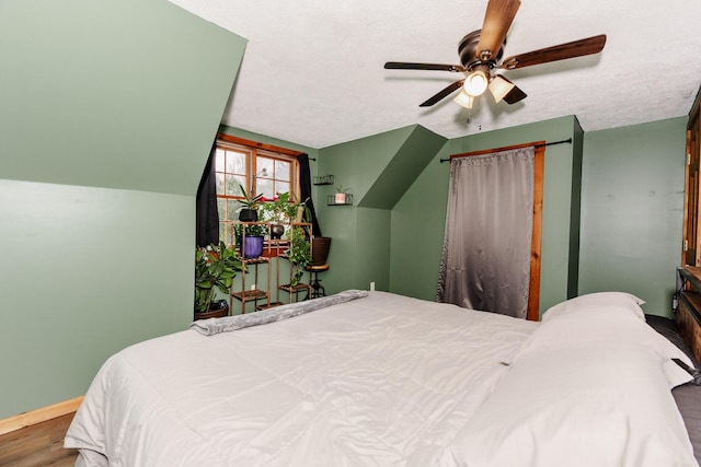 129 Bailey Hill Rd, New Sharon, ME 04955 - bedroom featuring ceiling fan, baseboards, wood finished floors, and a textured ceiling