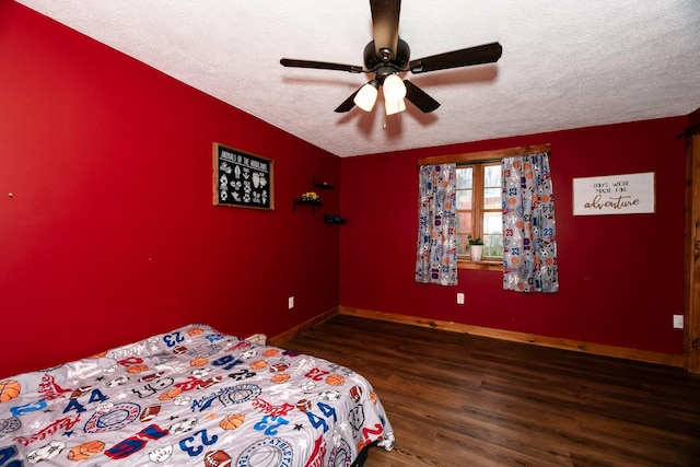 129 Bailey Hill Rd, New Sharon, ME 04955 - bedroom with ceiling fan, baseboards, wood finished floors, and a textured ceiling