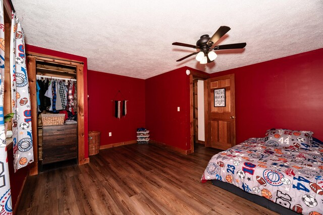 129 Bailey Hill Rd, New Sharon, ME 04955 - bedroom featuring a closet, wood finished floors, a textured ceiling, and a ceiling fan