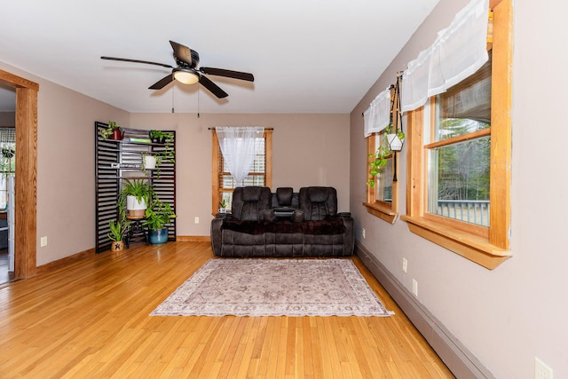 129 Bailey Hill Rd, New Sharon, ME 04955 - living room with ceiling fan, baseboards, and wood finished floors
