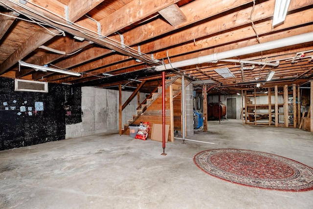 129 Bailey Hill Rd, New Sharon, ME 04955 - unfinished basement featuring heating fuel and stairway