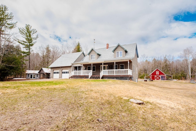 129 Bailey Hill Rd, New Sharon, ME 04955 - view of front of property featuring covered porch, an outdoor structure, a front yard, a garage, and a barn