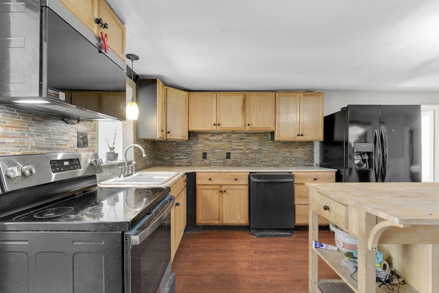 kitchen with a sink, light brown cabinets, light countertops, black appliances, and dark wood-style flooring