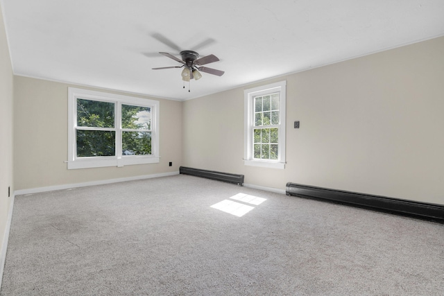 carpeted spare room featuring a baseboard radiator, ceiling fan, a baseboard heating unit, and baseboards
