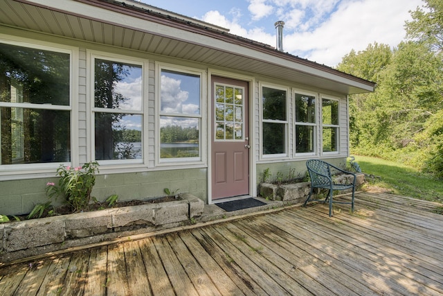 property entrance featuring a wooden deck