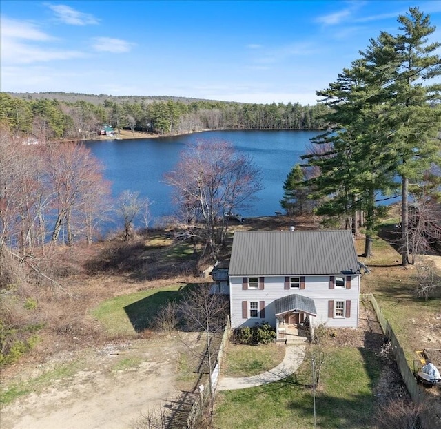 aerial view with a water view and a forest view