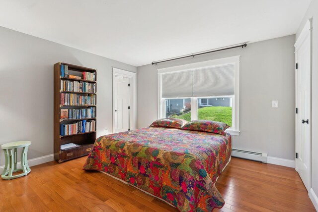 15 Callaway Dr Unit 15, Gray, ME 04039 - bedroom with baseboards, wood finished floors, and baseboard heating