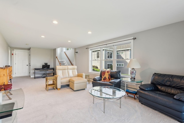 carpeted living room with recessed lighting, a baseboard radiator, and stairway
