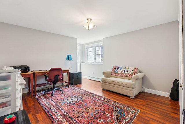office with baseboards, baseboard heating, and wood finished floors