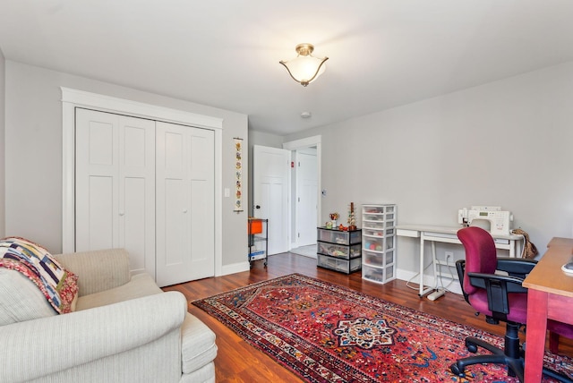 office area featuring baseboards and wood finished floors