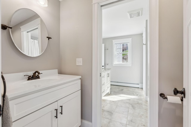 bathroom with vanity and a baseboard radiator