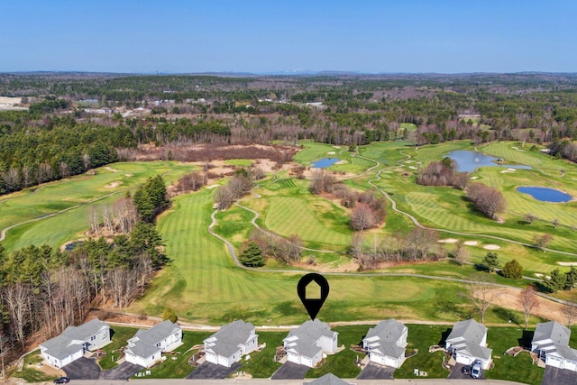 aerial view featuring a water view, view of golf course, and a residential view