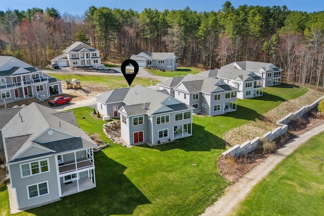 bird's eye view featuring a residential view and a forest view