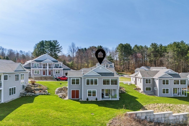 back of property featuring a yard