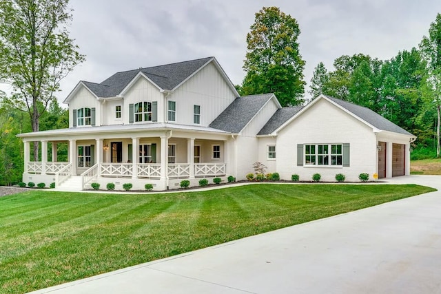modern inspired farmhouse featuring board and batten siding, driveway, a front lawn, and covered porch