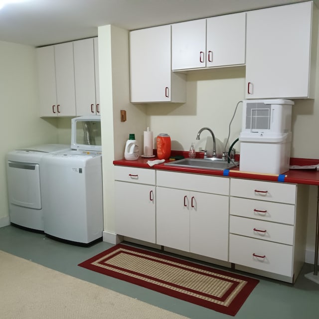 5 Southernpoint Rd, Bristol, ME 04564 - kitchen with washer and dryer, white cabinetry, and a sink