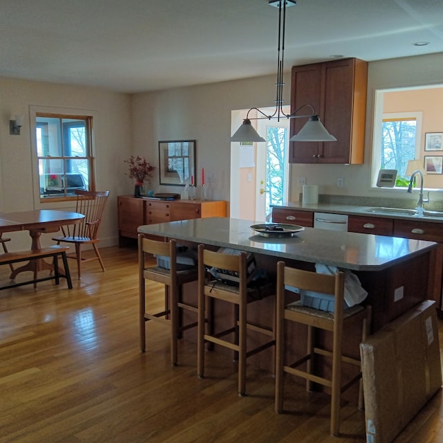 5 Southernpoint Rd, Bristol, ME 04564 - kitchen featuring a sink, wood finished floors, a center island, dishwasher, and hanging light fixtures