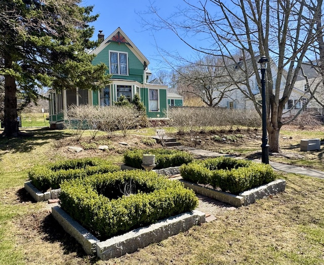 14 Water St, Vinalhaven, ME 04863 - view of front of property featuring a chimney and a sunroom