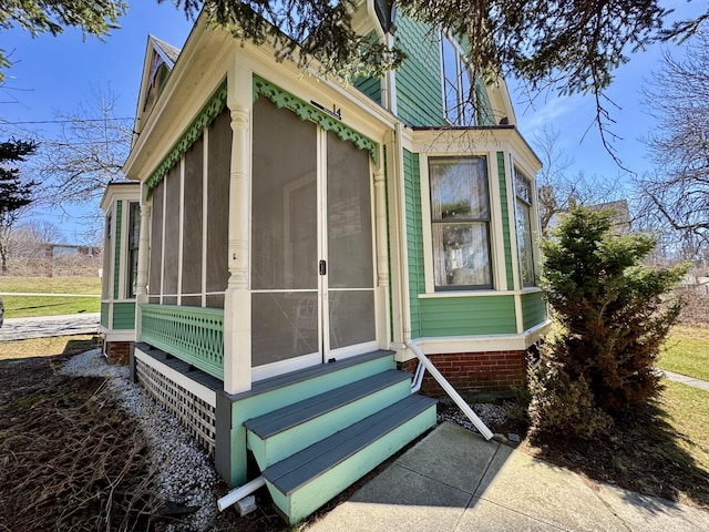 14 Water St, Vinalhaven, ME 04863 - view of side of home featuring entry steps and a sunroom