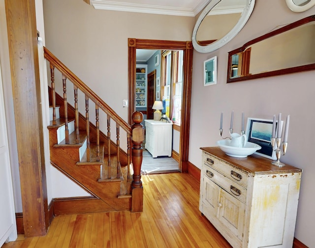 14 Water St, Vinalhaven, ME 04863 - foyer entrance featuring crown molding, stairs, and light wood finished floors