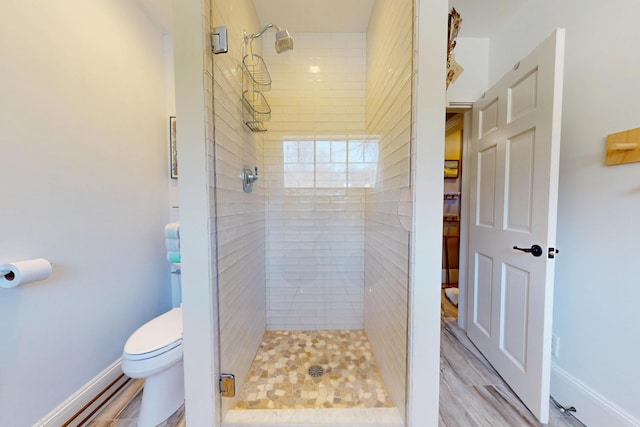 14 Water St, Vinalhaven, ME 04863 - full bathroom with baseboards, wood finished floors, a shower stall, and toilet