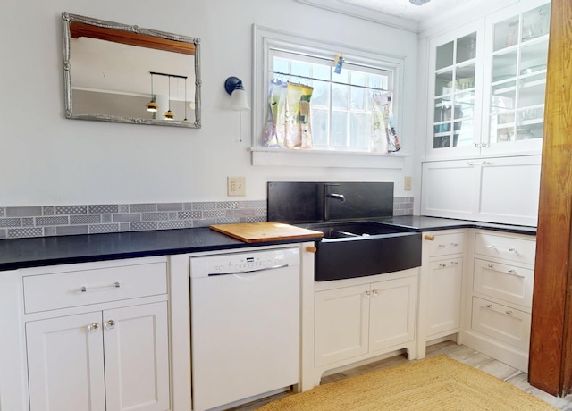 14 Water St, Vinalhaven, ME 04863 - kitchen with white cabinets, dark countertops, a sink, white dishwasher, and glass insert cabinets