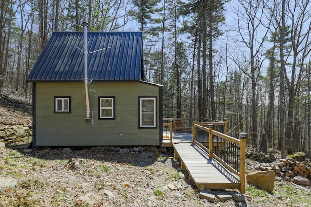 1 Good Day Dr, South Bristol, ME 04568 - view of home's exterior with a wooden deck and metal roof