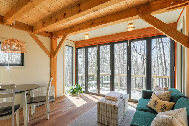 1 Good Day Dr, South Bristol, ME 04568 - living area with beamed ceiling, wood finished floors, a wealth of natural light, and wooden ceiling
