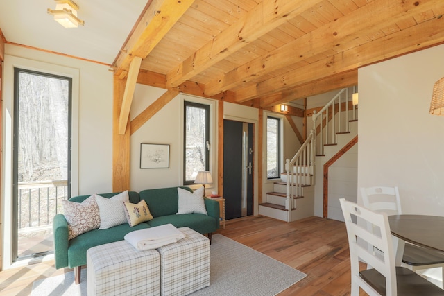 1 Good Day Dr, South Bristol, ME 04568 - living area featuring plenty of natural light, wood finished floors, beam ceiling, and stairs
