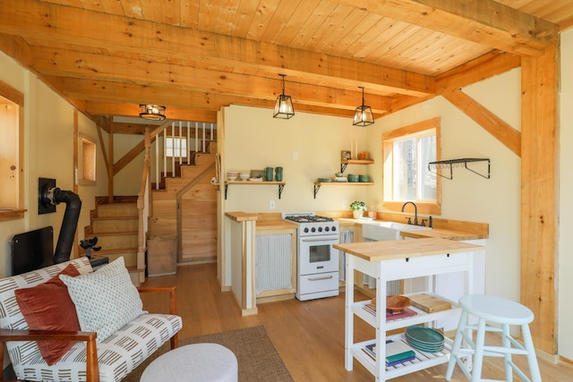 1 Good Day Dr, South Bristol, ME 04568 - kitchen with a sink, light wood-style floors, wooden counters, open shelves, and white gas range
