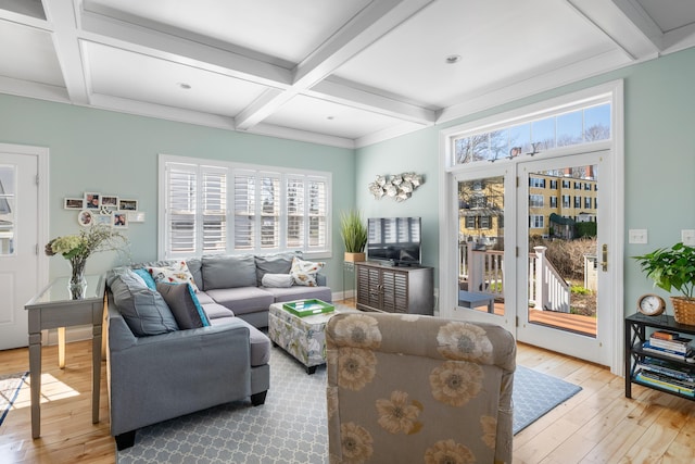 living area featuring hardwood / wood-style floors, beamed ceiling, and coffered ceiling
