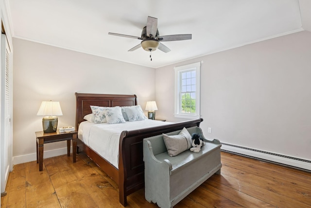 581 Bald Hill Rd, New Gloucester, ME 04260 - bedroom with light wood-style floors, a baseboard heating unit, crown molding, ceiling fan, and baseboards