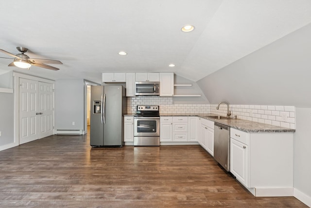 581 Bald Hill Rd, New Gloucester, ME 04260 - kitchen with stainless steel appliances, a sink, a baseboard heating unit, decorative backsplash, and lofted ceiling