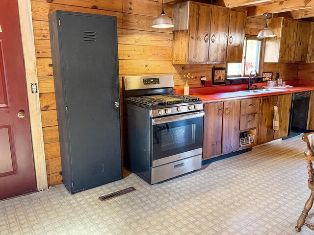 450 Greenwoods Rd, Peru, ME 04290 - kitchen featuring a sink, gas range, wood walls, black dishwasher, and visible vents