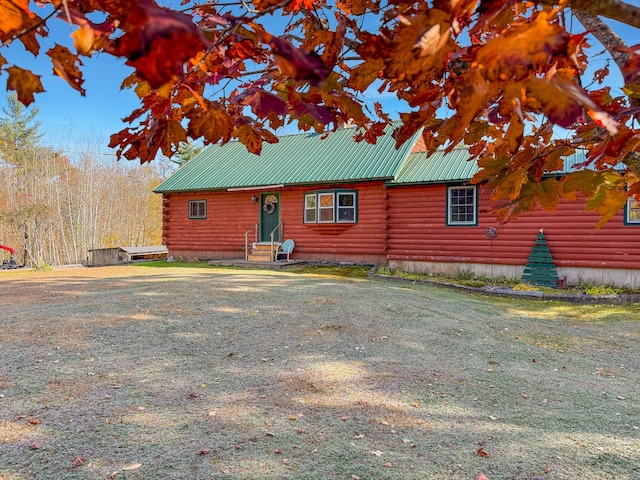 450 Greenwoods Rd, Peru, ME 04290 - view of property exterior featuring log exterior, entry steps, and metal roof