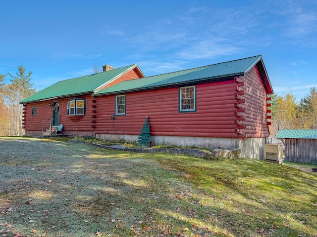 450 Greenwoods Rd, Peru, ME 04290 - view of side of property with a yard, log exterior, entry steps, and metal roof