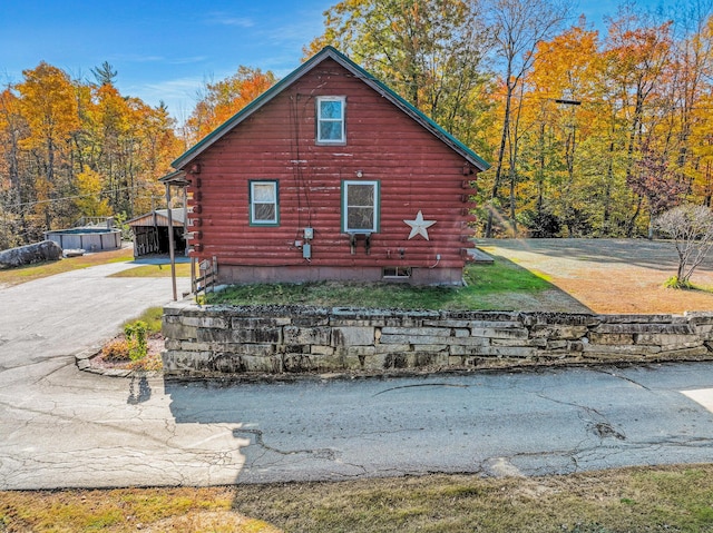 450 Greenwoods Rd, Peru, ME 04290 - view of property exterior with aphalt driveway and log siding