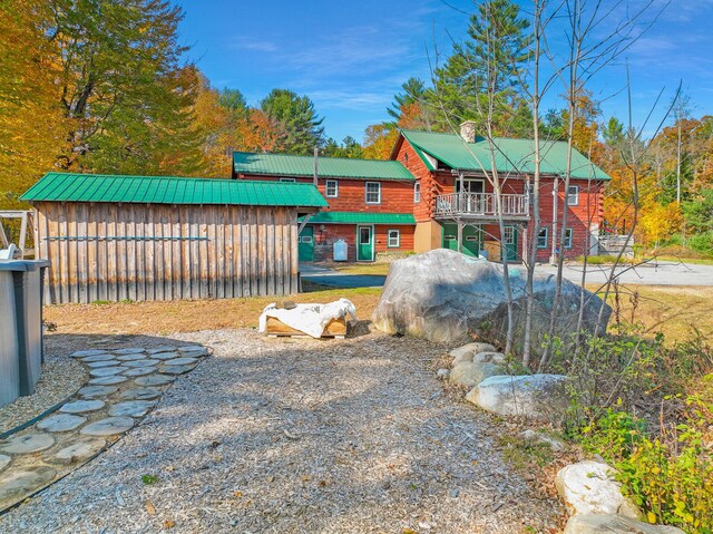 450 Greenwoods Rd, Peru, ME 04290 - exterior space featuring an outbuilding and a deck