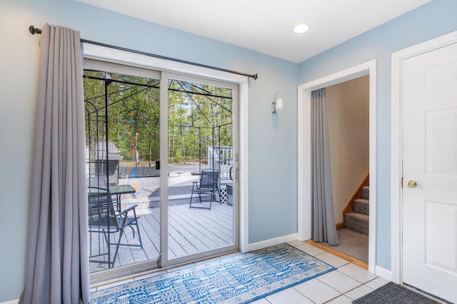 doorway featuring stairway, tile patterned floors, baseboards, and recessed lighting