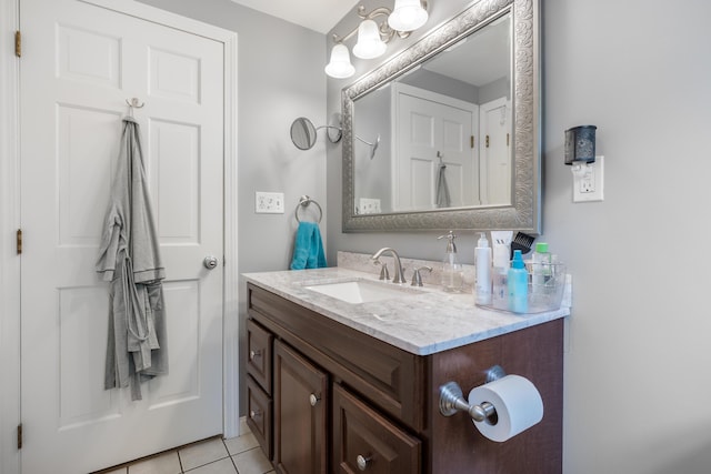 bathroom with tile patterned flooring and vanity