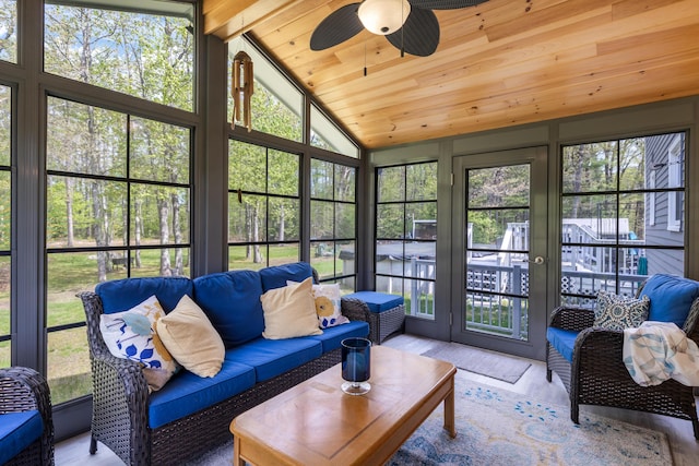 sunroom featuring ceiling fan and outdoor lounge area