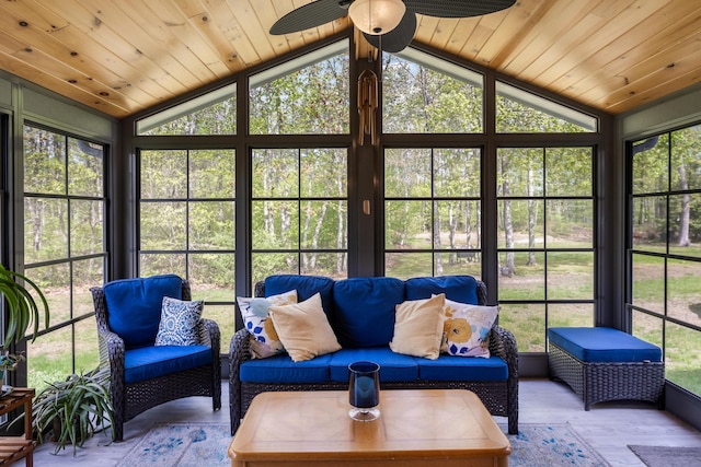 sunroom / solarium with lofted ceiling, ceiling fan, and an outdoor hangout area