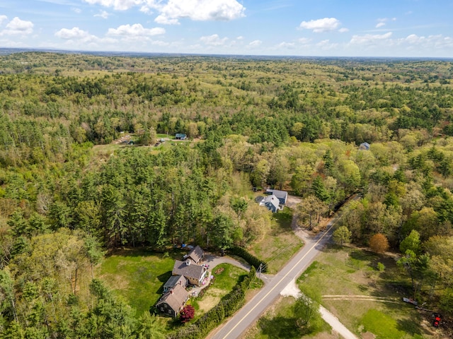 aerial overview of property's location featuring a heavily wooded area