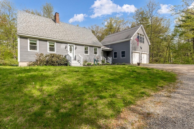 view of front of property with a chimney, driveway, a garage, a front yard, and roof with shingles