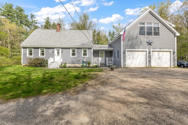 view of front of property with a chimney, an attached garage, asphalt driveway, and a front yard