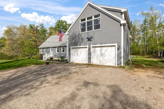 view of front of home featuring asphalt driveway