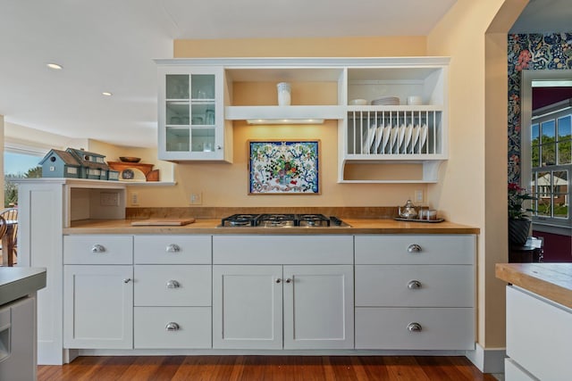 18 Pleasant St, Newcastle, ME 04553 - kitchen with open shelves, stainless steel gas stovetop, glass insert cabinets, butcher block countertops, and white cabinetry