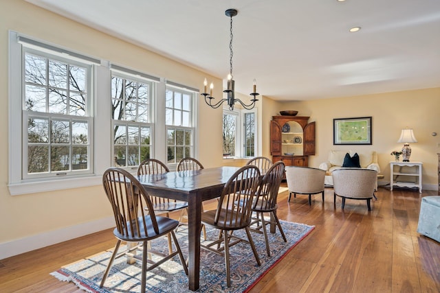 18 Pleasant St, Newcastle, ME 04553 - dining room with a chandelier, baseboards, hardwood / wood-style flooring, and recessed lighting